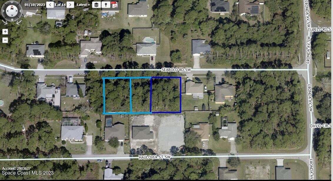 1260 Triple Road Palm Bay, FL 32908 - Photo 4 of 5 an aerial view of houses and roads