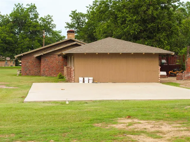 a backyard of a house with lots of green space