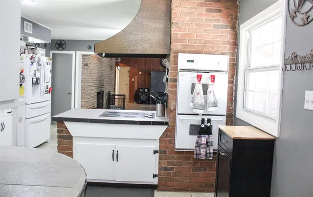 a room with cabinets and window