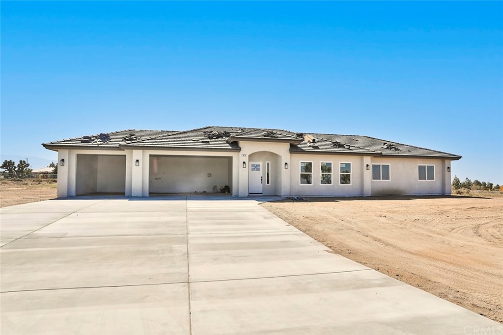 9476 Windermere Road Phelan, CA 92371 - Photo 1 of 1 a front view of a house with a large window
