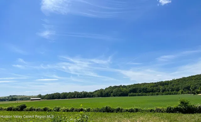 an aerial view of a houses with outdoor space