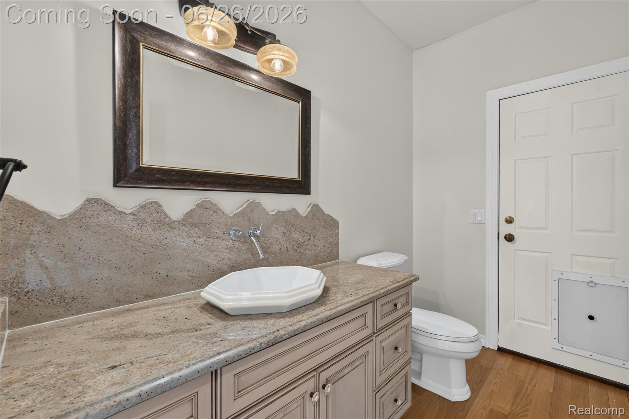 3478 Lexington Road Waterford, MI 48328 - Photo 12 of 52 Bathroom featuring a light-colored vanity with a natural stone countertop, a white vessel sink, and a wall-mounted faucet