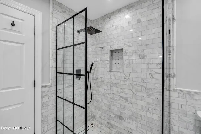 a bedroom with a bed and a potted plant