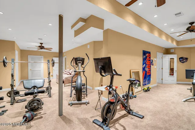 a view of a patio with couches chairs and a umbrella
