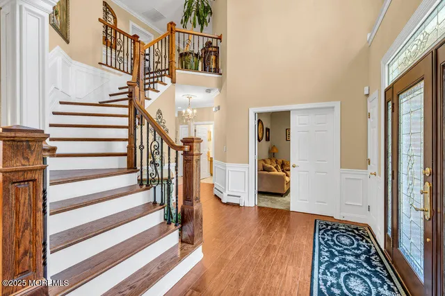 a view of staircase with white walls and a window