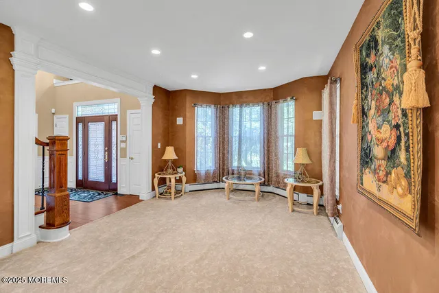 a view of a dining room with furniture wooden floor and chandelier