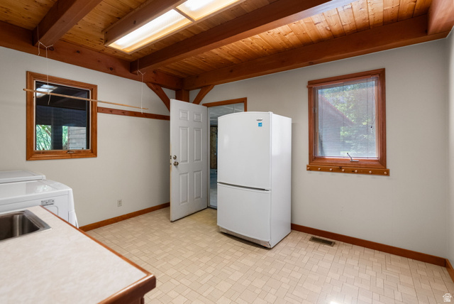 435 Canyon Road Millville, UT 84326 - Photo 22 of 113 Wood-beamed ceiling with an integrated skylight and exposed wood supports