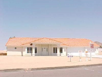 16286 Olalee Road Apple Valley, CA 92307 - Photo 1 of 1 a very nice looking building with a large window