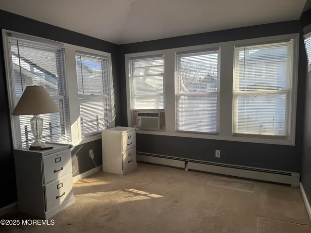 a room with window and furniture