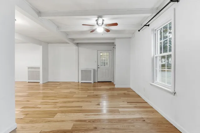 a picture of a bathroom with a white wall and a white wall
