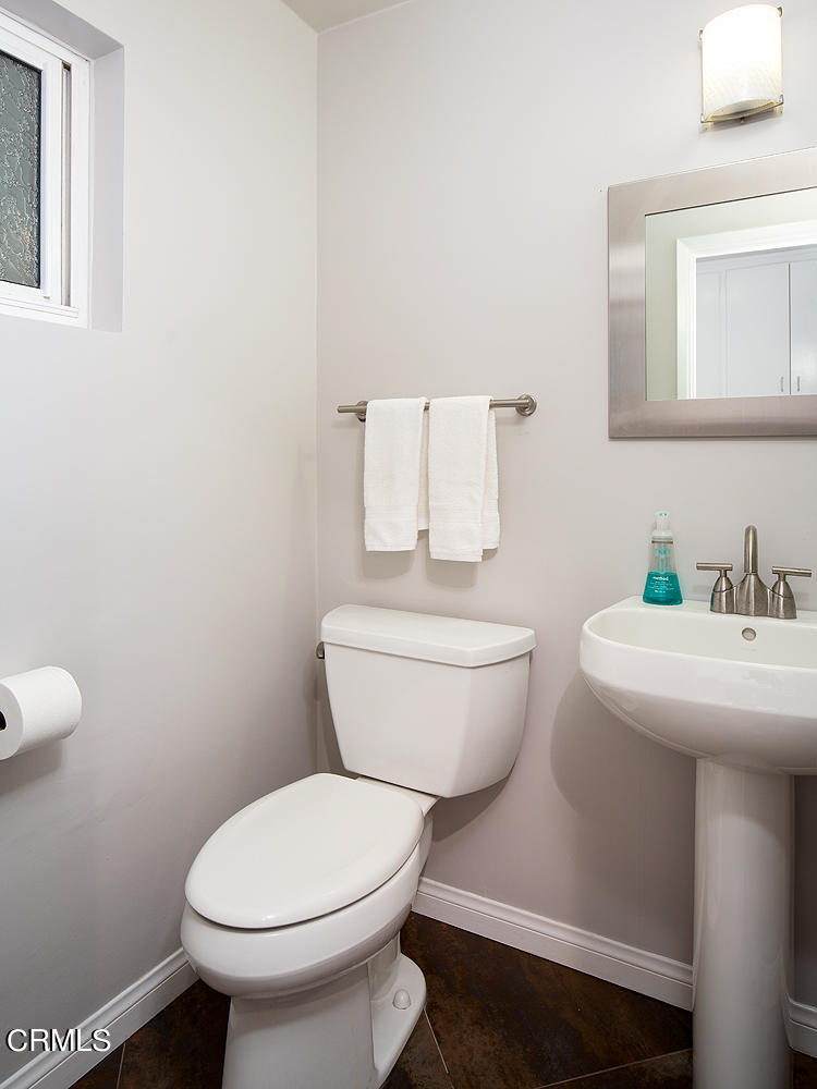1400 Edgecliff Lane Pasadena, CA 91107 - Photo 21 of 43 a white toilet sitting next to a bathroom sink