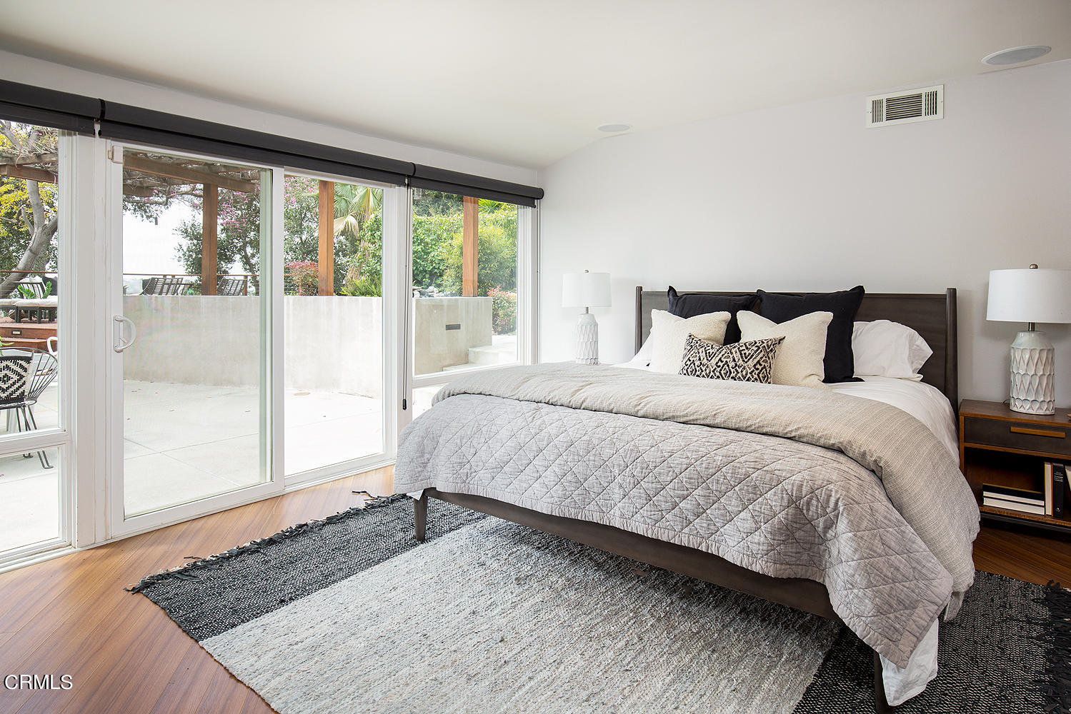 1400 Edgecliff Lane Pasadena, CA 91107 - Photo 22 of 43 a large bed sitting in a bedroom next to a window