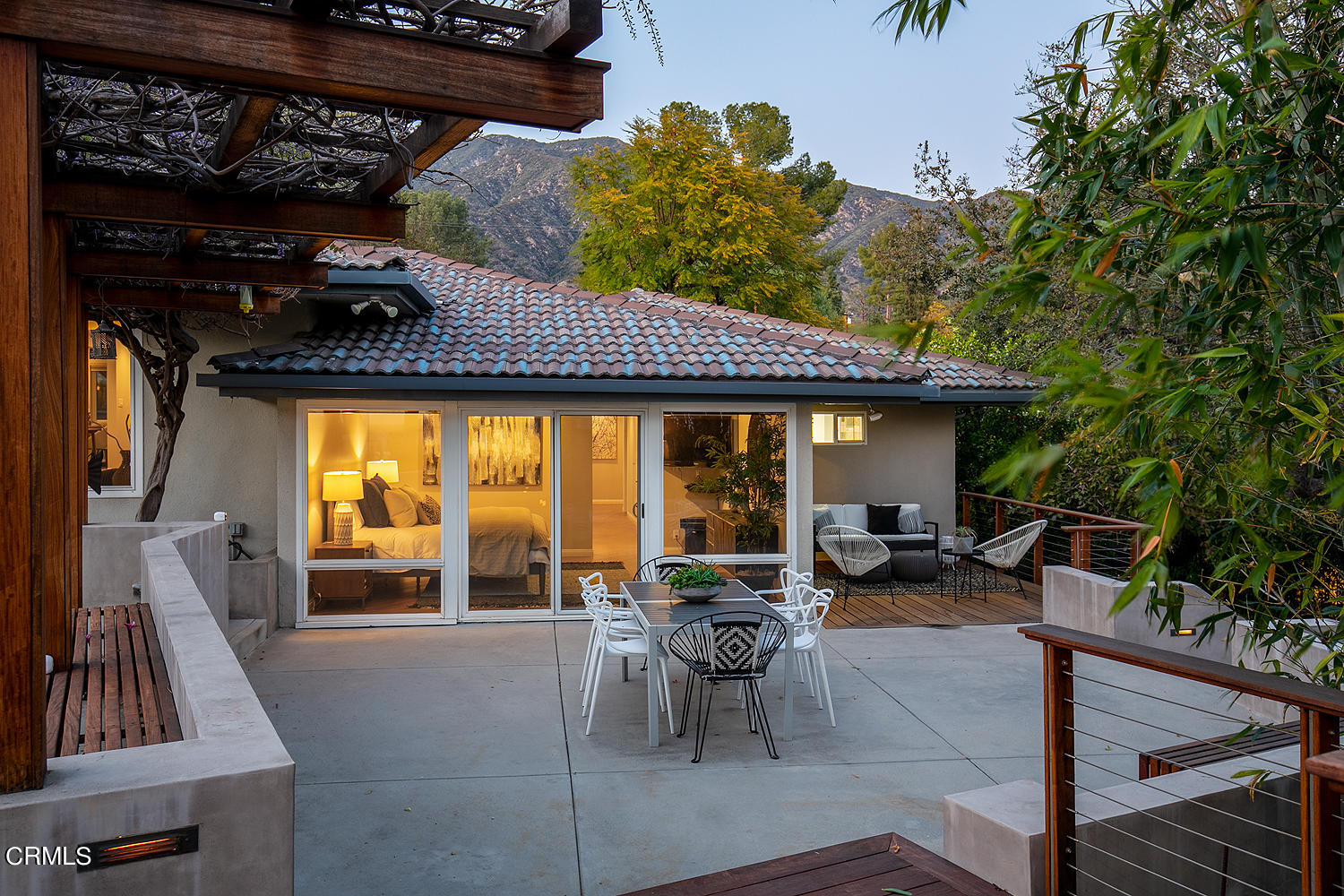 1400 Edgecliff Lane Pasadena, CA 91107 - Photo 24 of 43 a view of patio with table and chairs potted plants and large tree