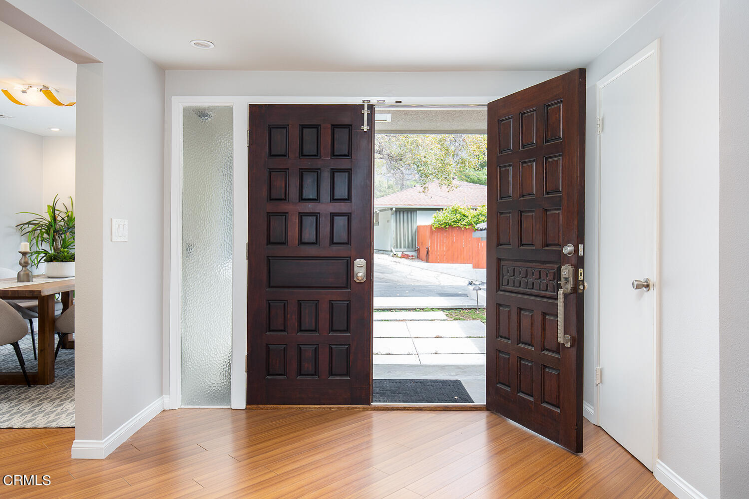 1400 Edgecliff Lane Pasadena, CA 91107 - Photo 6 of 43 a view of an entryway with wooden floor and windows
