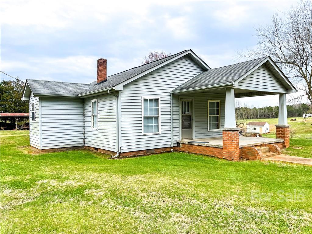 8548 Jc Road Vale, NC 28168 - Photo 1 of 20 a view of a house with a yard and deck