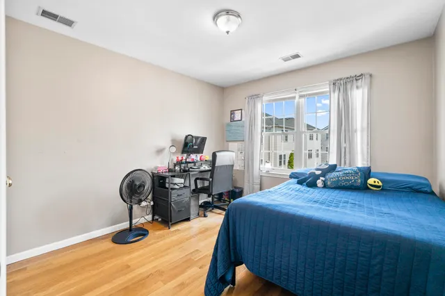 a bedroom with bed and a table