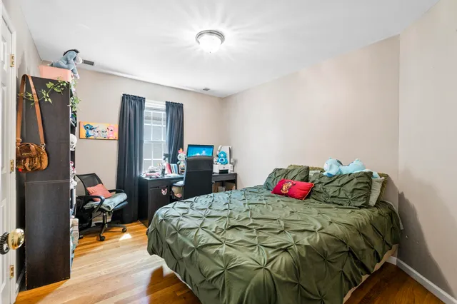 a bedroom with a bed and a closet