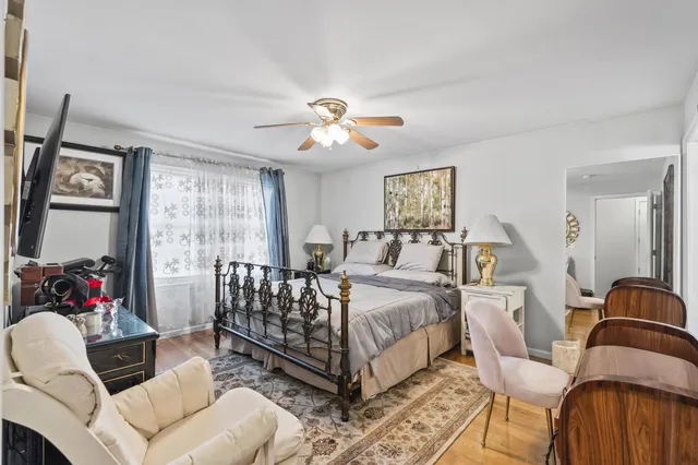 a spacious bedroom with a bed and a couch