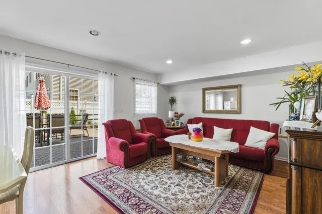 a living room with furniture and a rug
