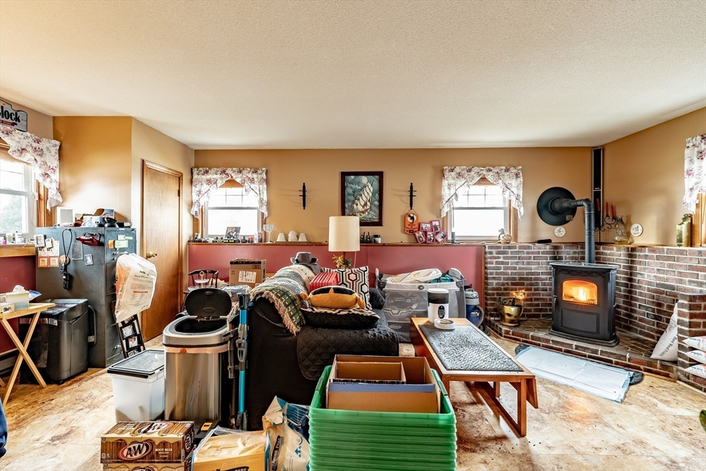 220 Senator Street Springfield, MA 01129 - Photo 20 of 33 a living room with furniture a rug and a fireplace
