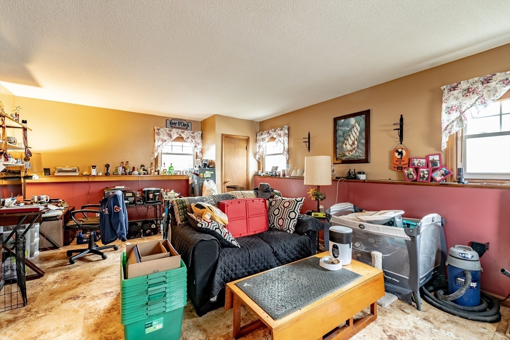 220 Senator Street Springfield, MA 01129 - Photo 21 of 33 a living room with furniture a rug and a floor to ceiling window