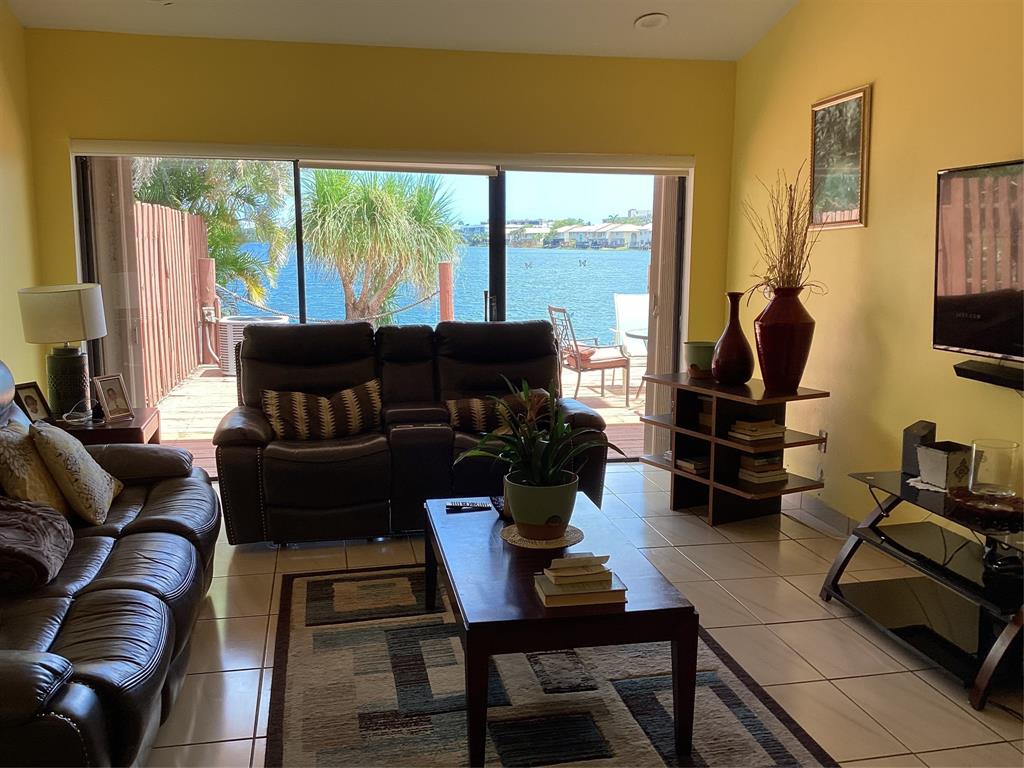 Ives Estates Miami, FL 33179 - Photo 6 of 15 a living room with furniture and a flat screen tv