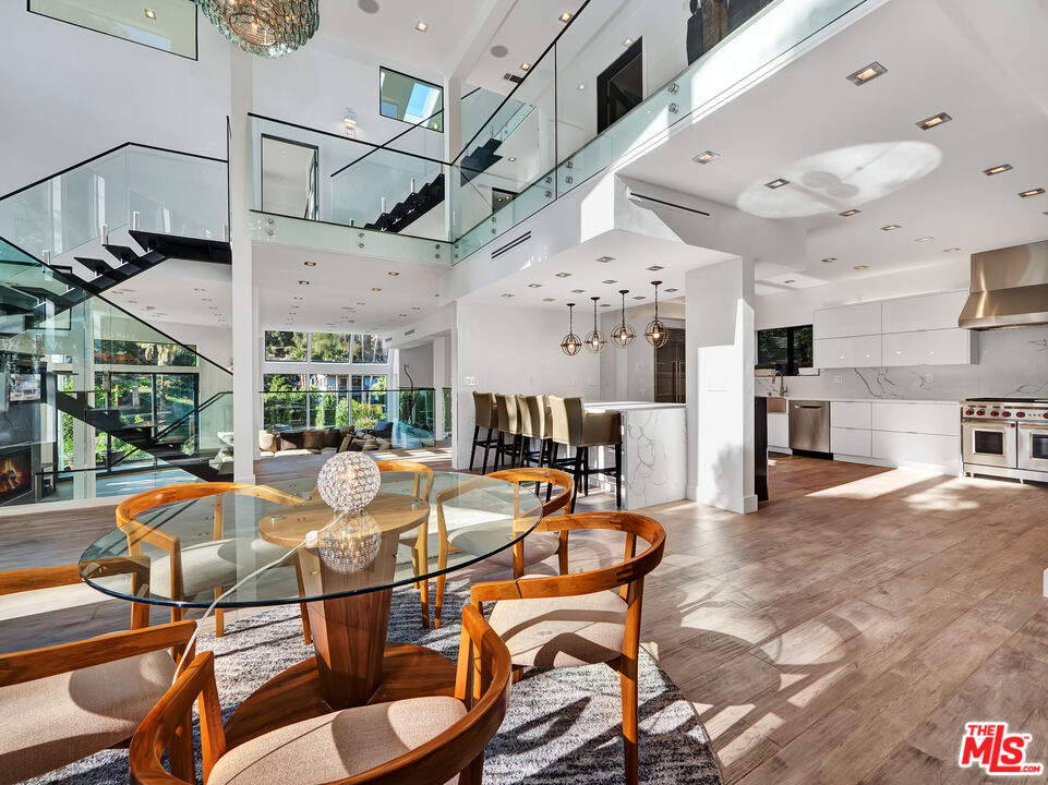 a dinning area with pool table and chairs