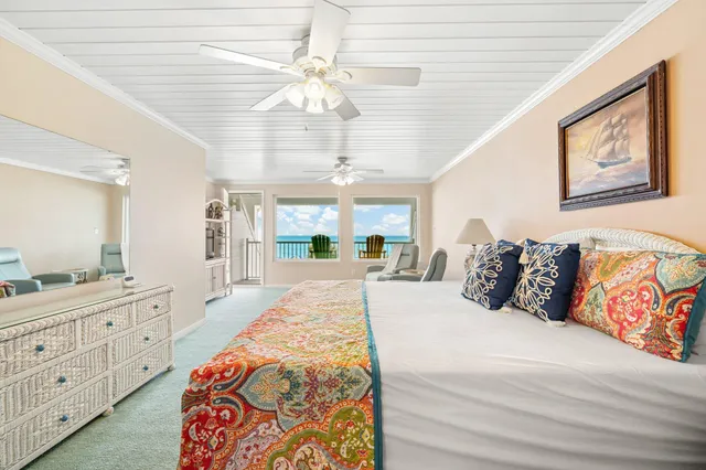 a bed room with a bed and a mirror