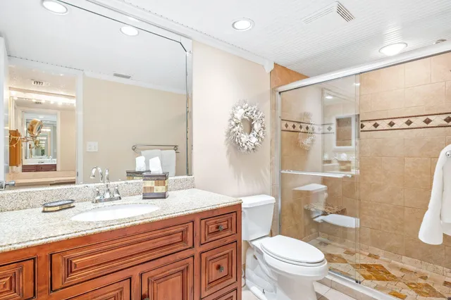 a bathroom with a sink a shower and a mirror