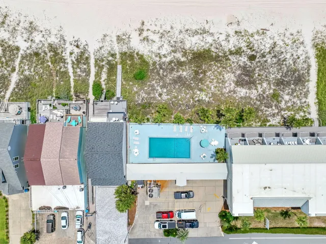 an aerial view of a house with a garden and yard