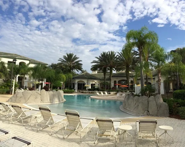 a view of a swimming pool with a patio