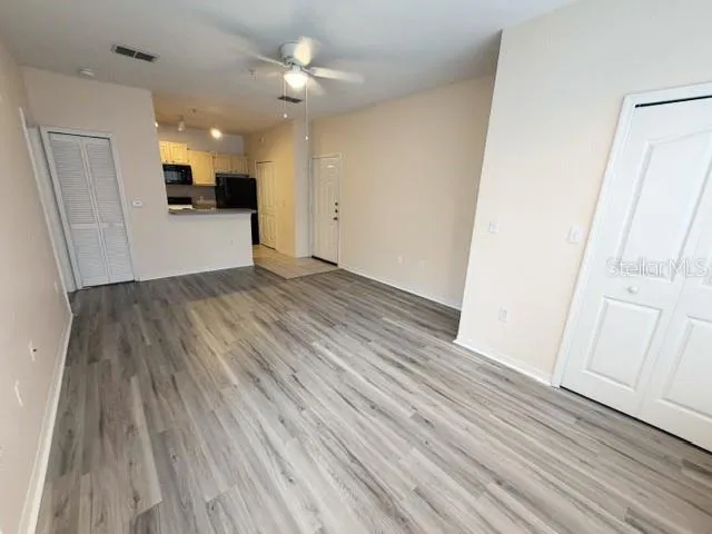a view of a kitchen from the hallway