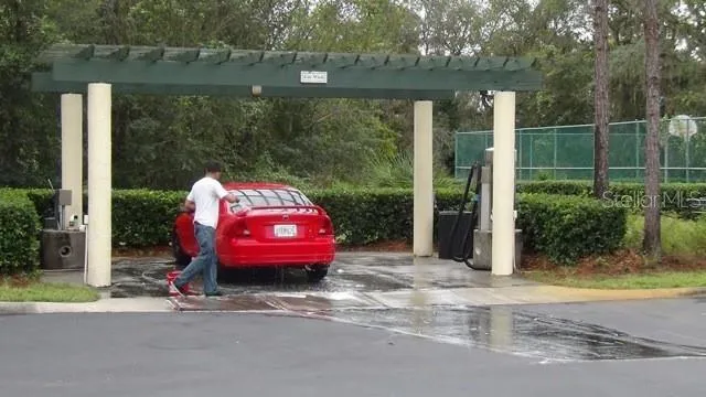 a view of backyard with swimming pool and outdoor seating