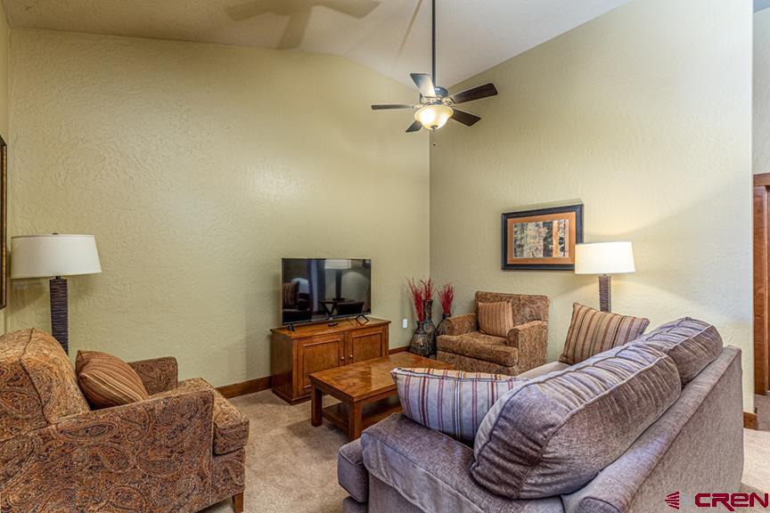 24 Sheol Street, Unit 503 R23 Durango, CO 81301 - Photo 20 of 44 a living room with furniture and a flat screen tv