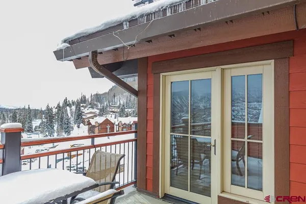 a view of a balcony with furniture