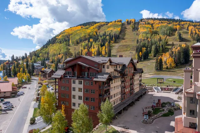 a view of a building with a yard