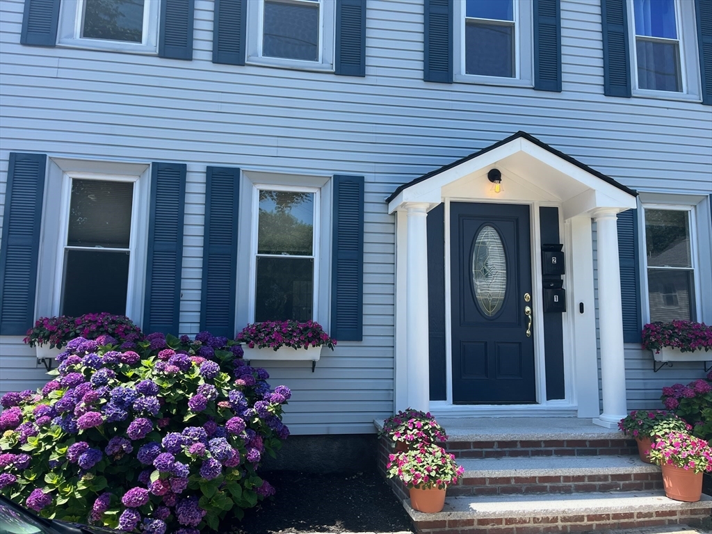 16 Port Norfolk Street, Unit 2 Boston, MA 02122 - Photo 1 of 20 a front view of a house