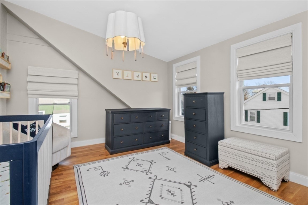 16 Port Norfolk Street, Unit 2 Boston, MA 02122 - Photo 14 of 20 a bedroom with furniture and a window