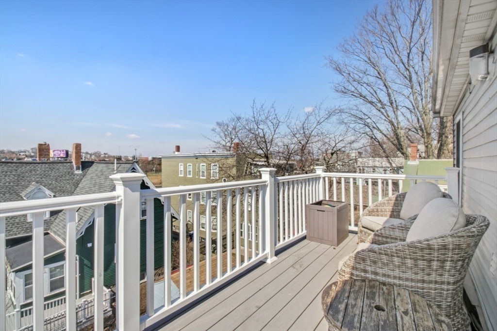 16 Port Norfolk Street, Unit 2 Boston, MA 02122 - Photo 15 of 20 a view of a balcony with wooden chairs