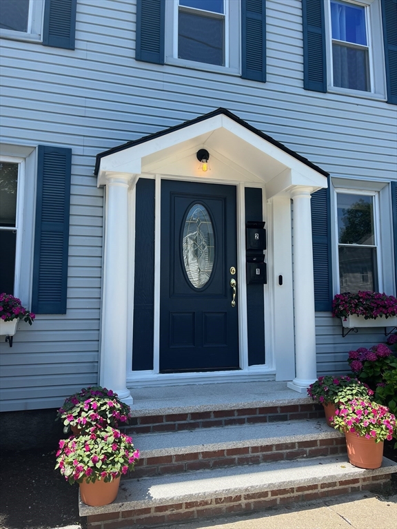 16 Port Norfolk Street, Unit 2 Boston, MA 02122 - Photo 20 of 20 a front view of a house with a garden