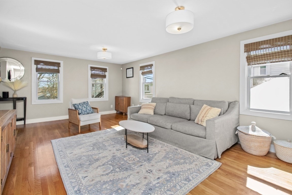 16 Port Norfolk Street, Unit 2 Boston, MA 02122 - Photo 3 of 20 a living room with furniture and wooden floor