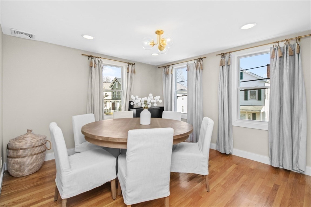 16 Port Norfolk Street, Unit 2 Boston, MA 02122 - Photo 5 of 20 a view of a dining room with furniture window and wooden floor