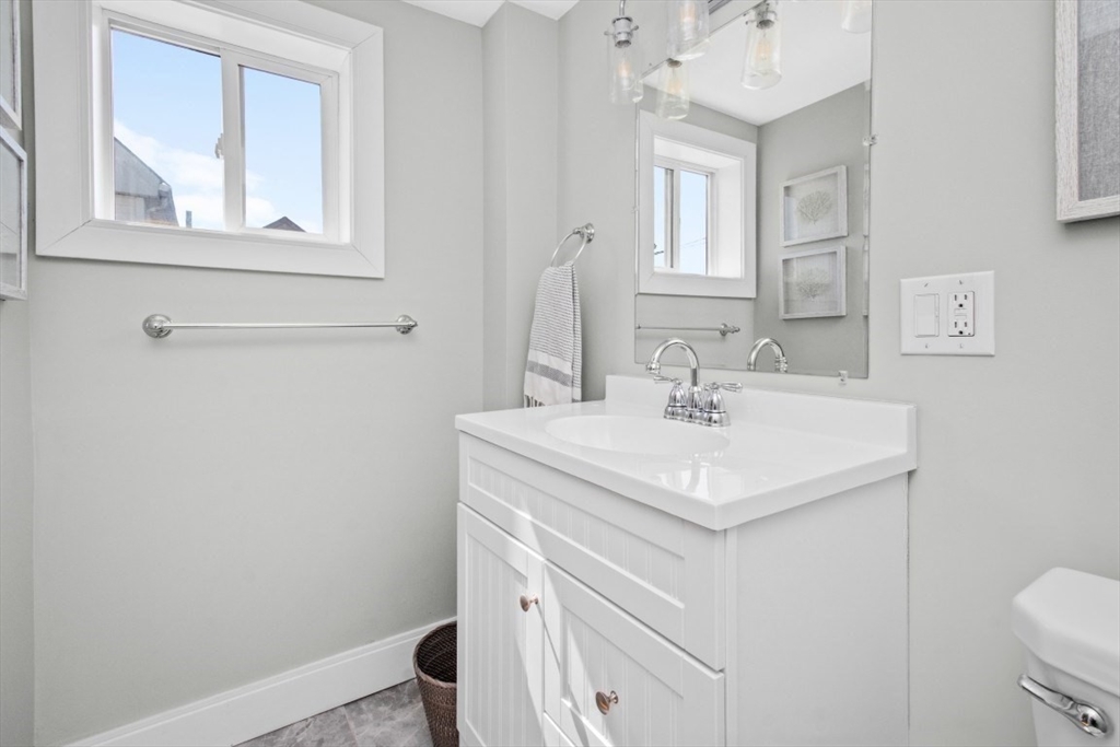 16 Port Norfolk Street, Unit 2 Boston, MA 02122 - Photo 10 of 20 a bathroom with a sink a vanity and a toilet