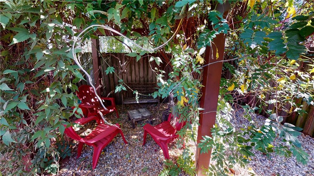 722 Madison Street Brooklyn, NY 11221 - Photo 11 of 29 a backyard of a house with lots of trees