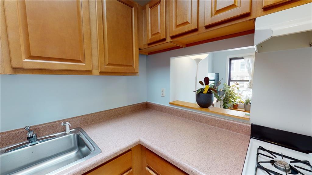 722 Madison Street Brooklyn, NY 11221 - Photo 17 of 29 a view of a room with a sink and cabinets