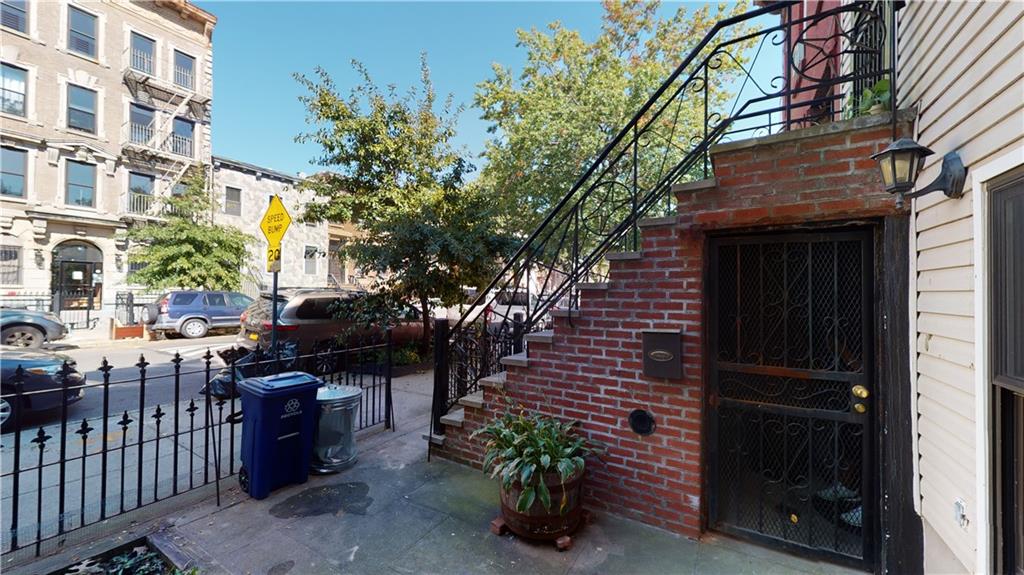 722 Madison Street Brooklyn, NY 11221 - Photo 3 of 29 a couple of people sitting in front of a building