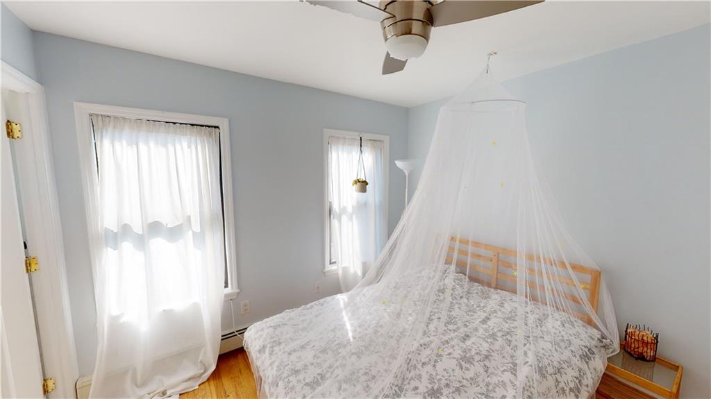 722 Madison Street Brooklyn, NY 11221 - Photo 21 of 29 a bedroom with a bed and a window