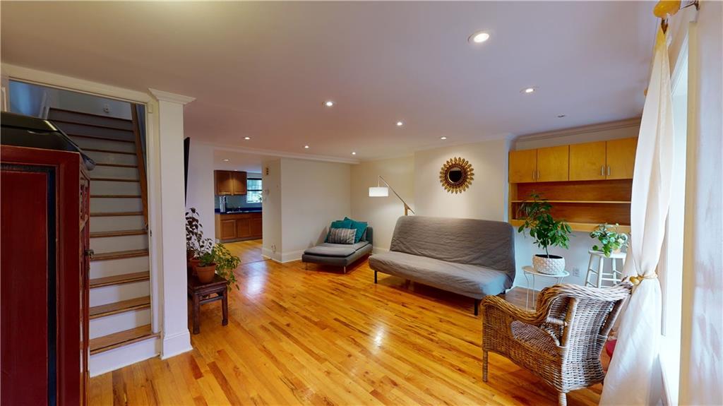 722 Madison Street Brooklyn, NY 11221 - Photo 7 of 29 a living room with furniture and a potted plant