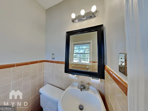 a bathroom with a sink a toilet and a bathtub