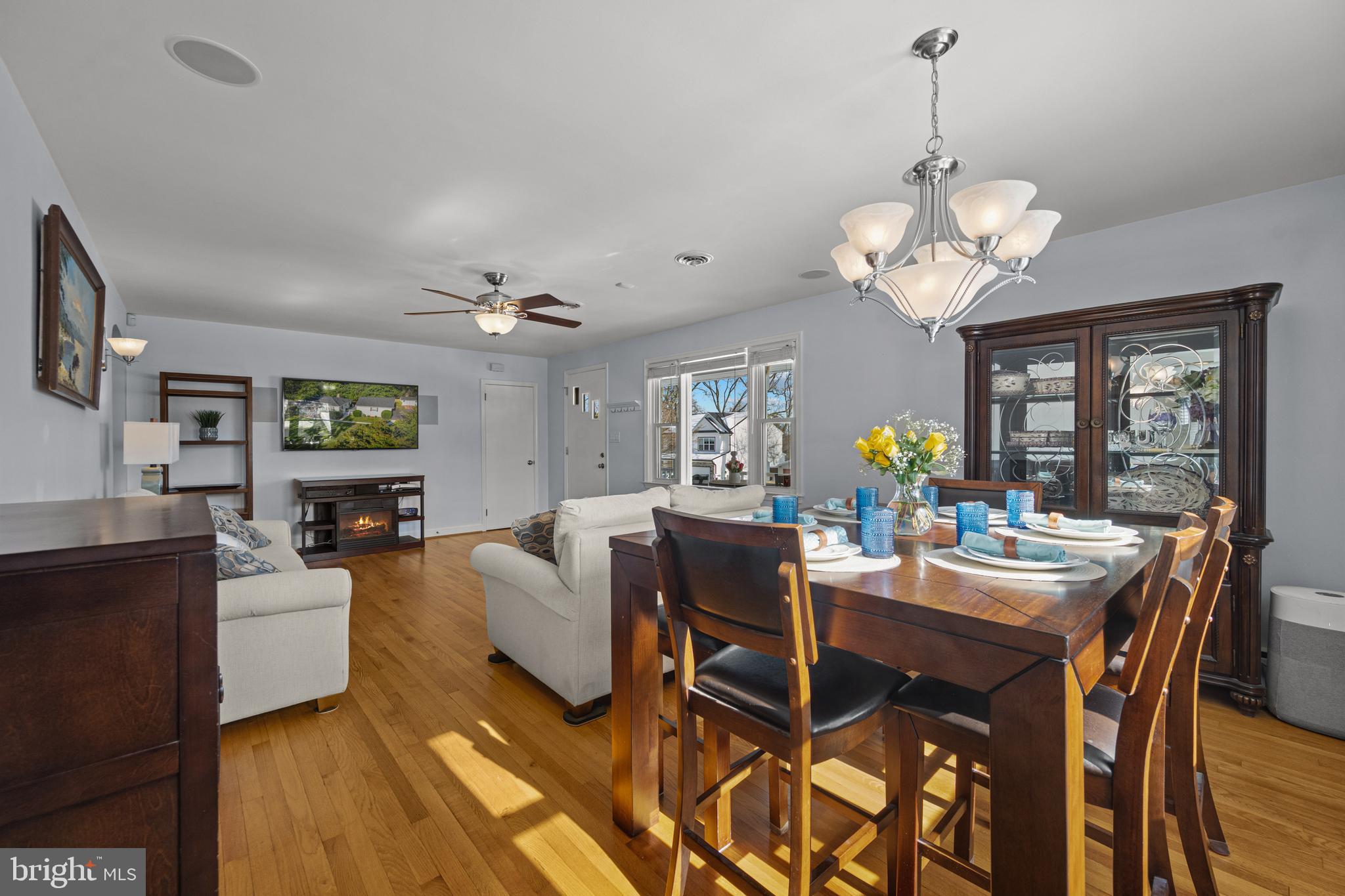 6226 2nd Avenue Hanover, MD 21076 - Photo 11 of 48 a view of a dining room with furniture wooden floor and chandelier